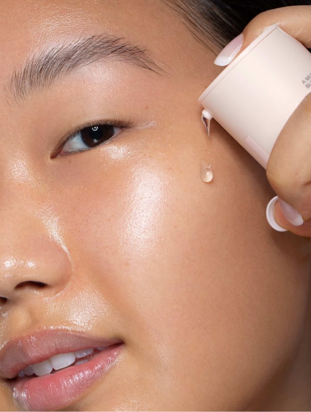 women using serum on skin