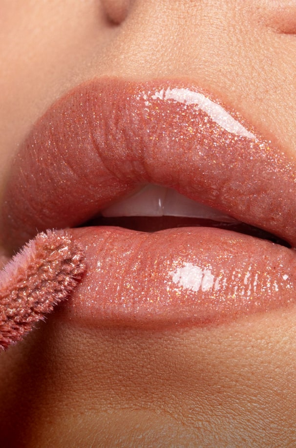 applying lipstick to lips